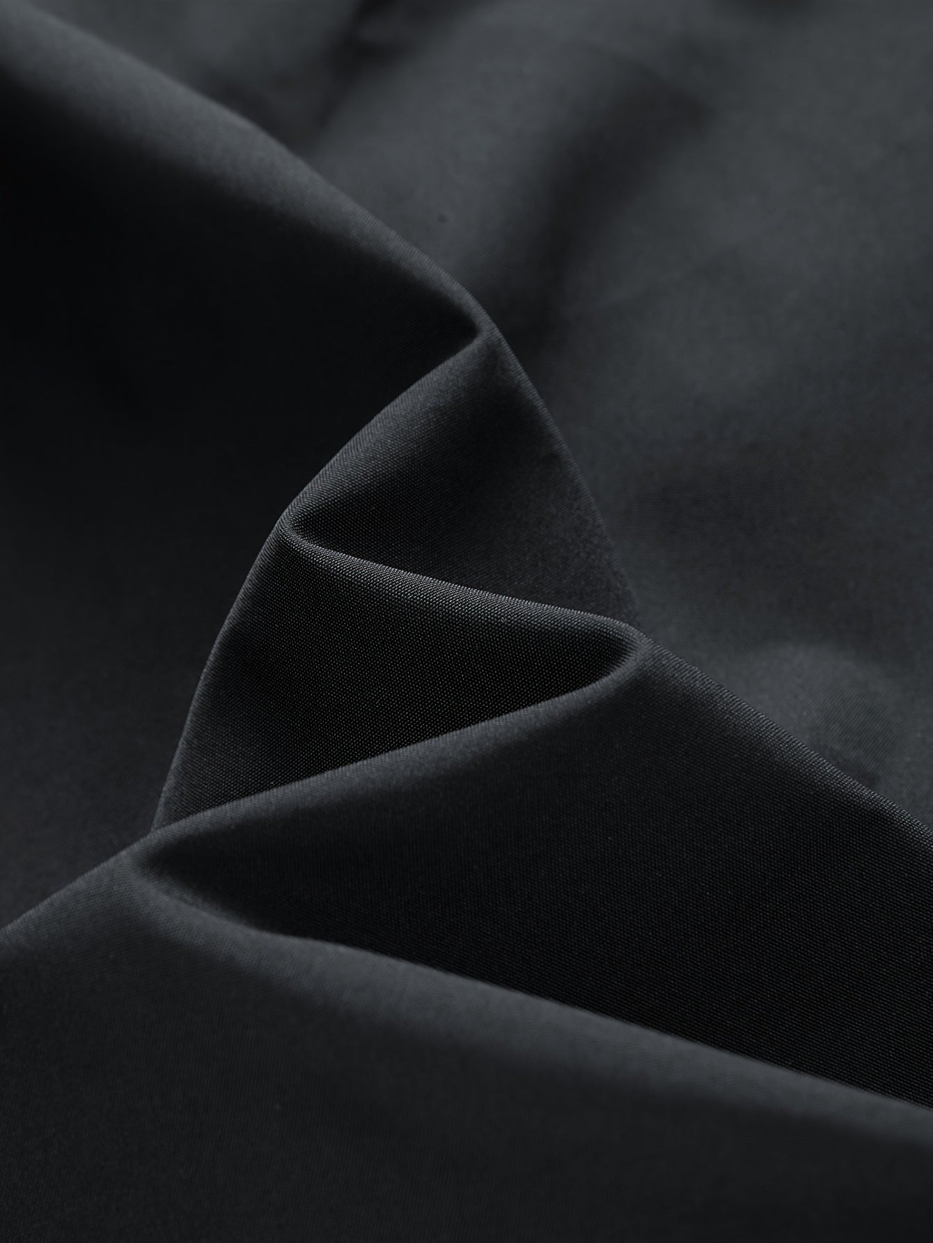 Black Water-Resistant Star-Print Oversized Hooded Windbreaker