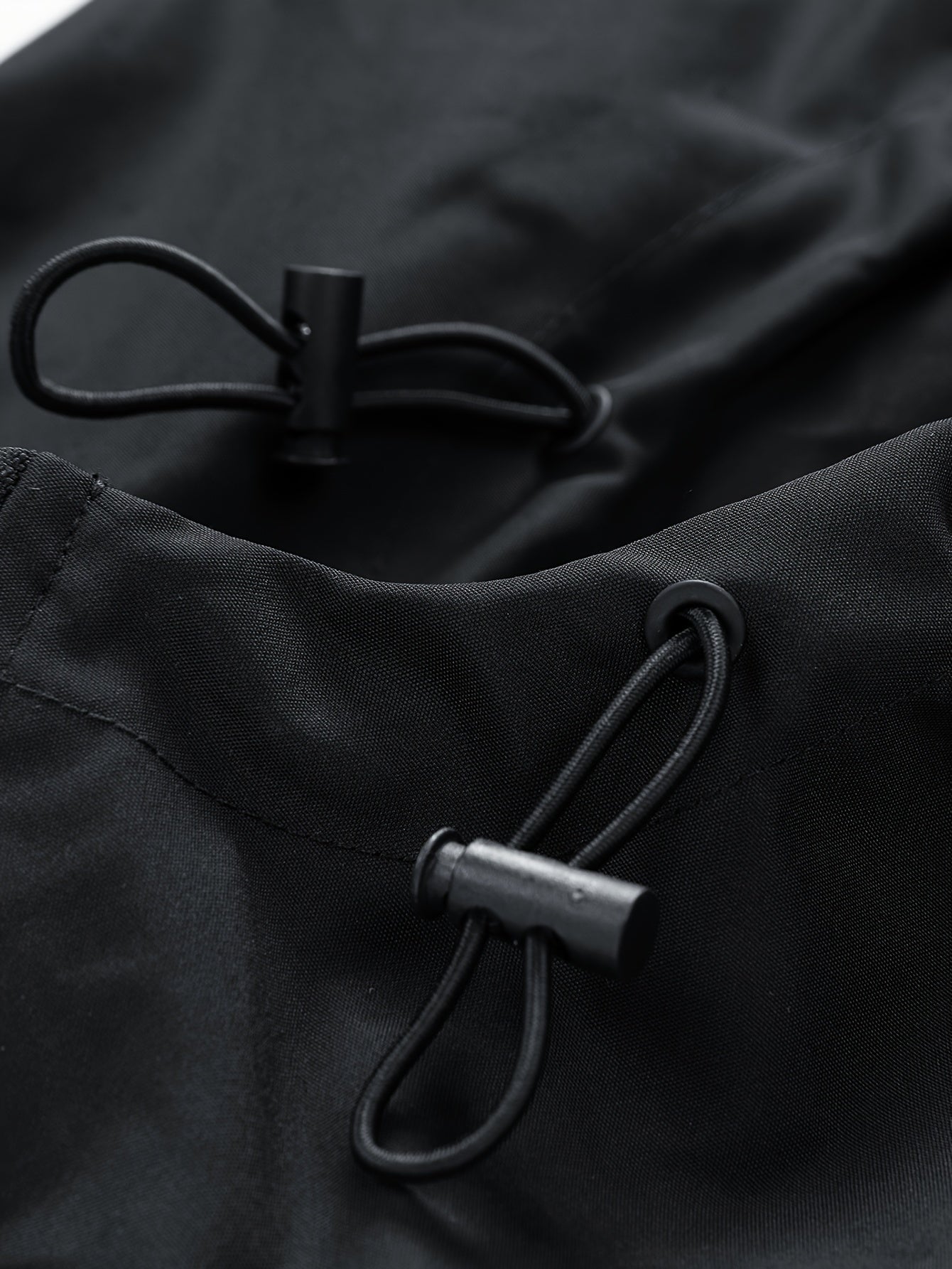 Black Water-Resistant Star-Print Oversized Hooded Windbreaker